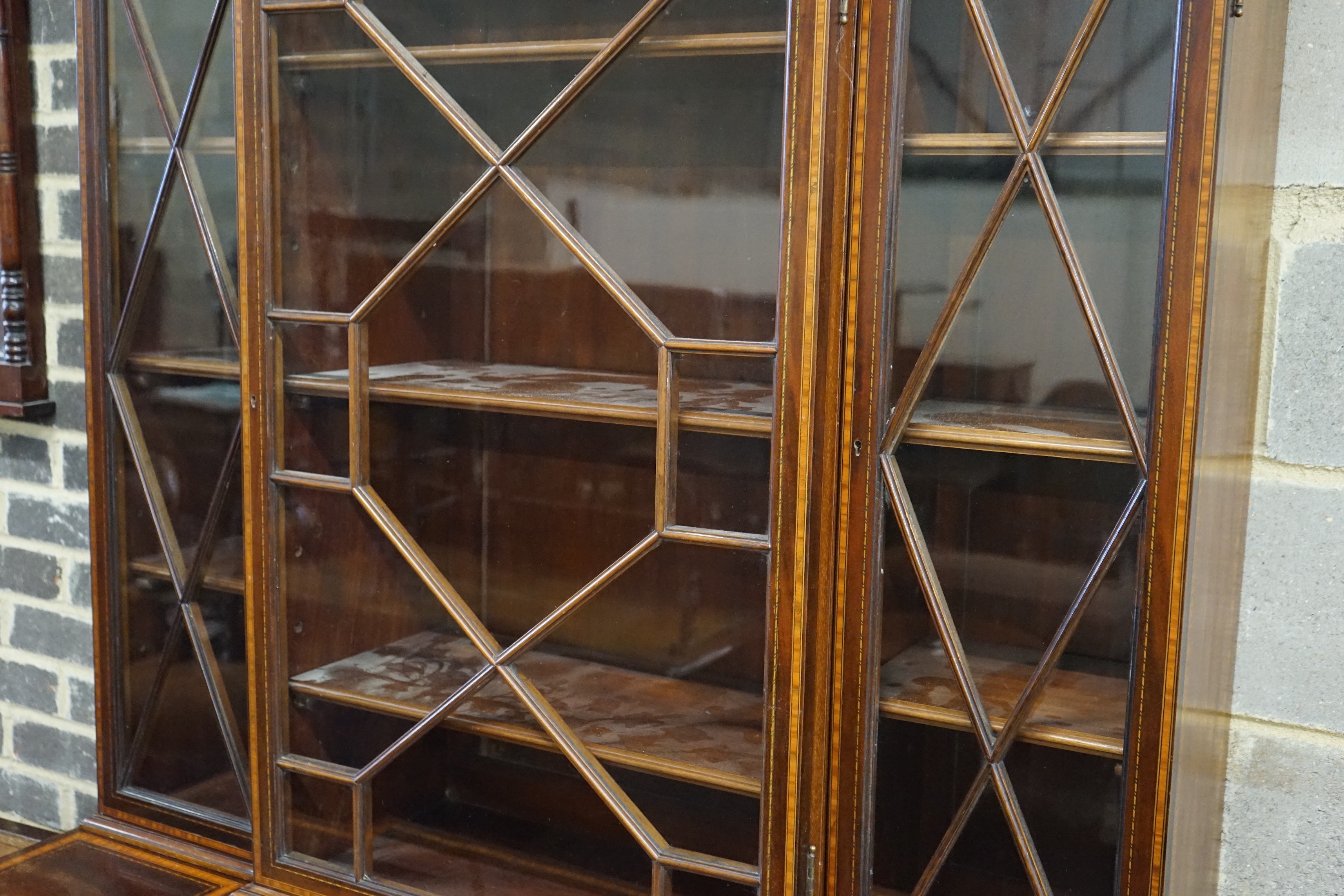 A small Edwardian satinwood banded mahogany breakfront bookcase, length 120cm, depth 55cm, height 201cm